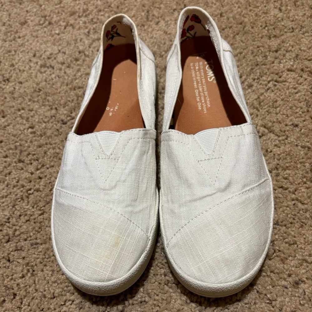 Tom’s White Slip Ons, size 7W.
